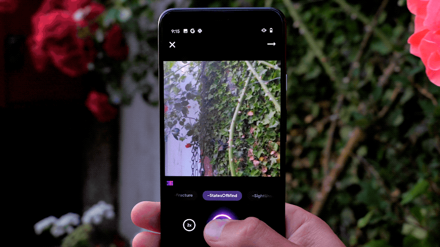 A phone held up to a garden, running a camera app with StatesOfMind and SightUnseen modes.