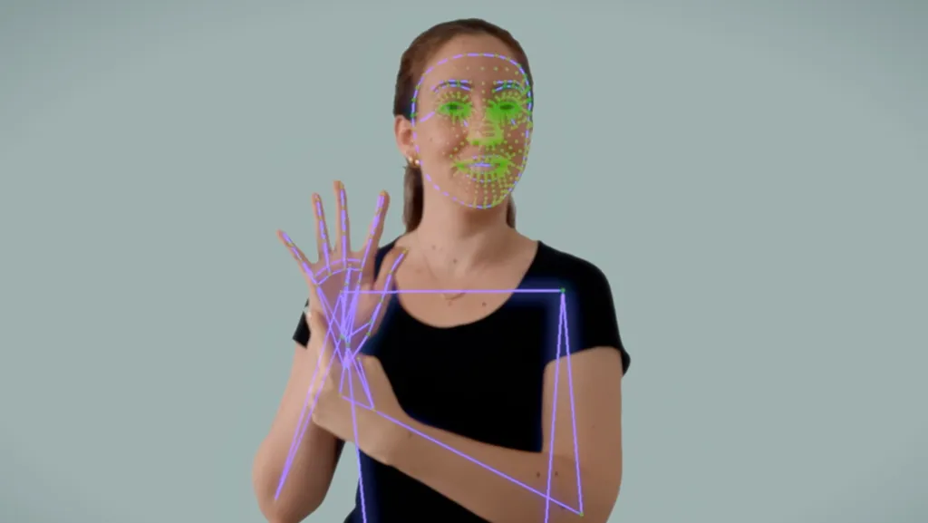 A person signing, with a face mesh and hand and arm skeleton tracked live over the video.